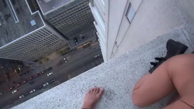 Girl Spits Cum Off Of Skyscraper